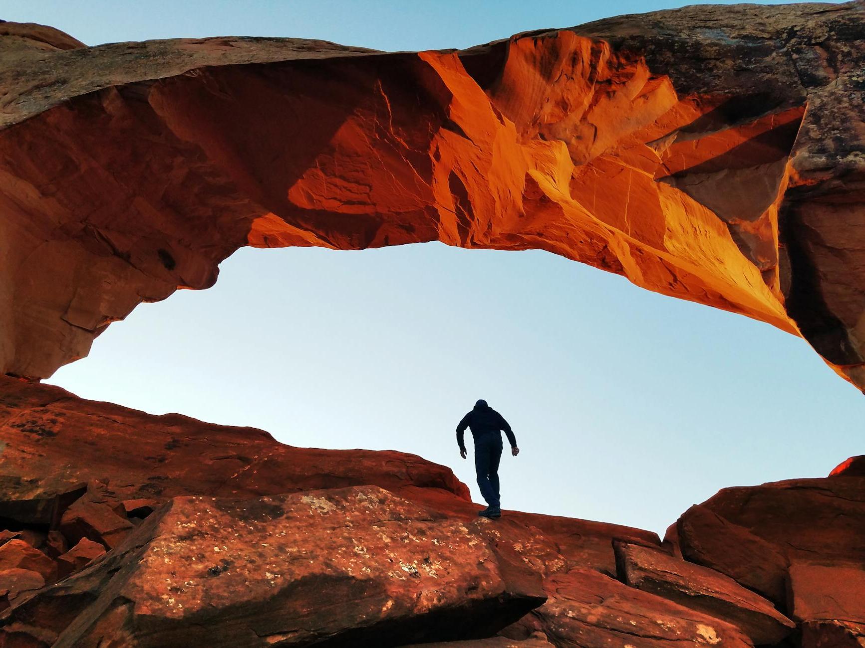 Person Standing on A Rock Formation