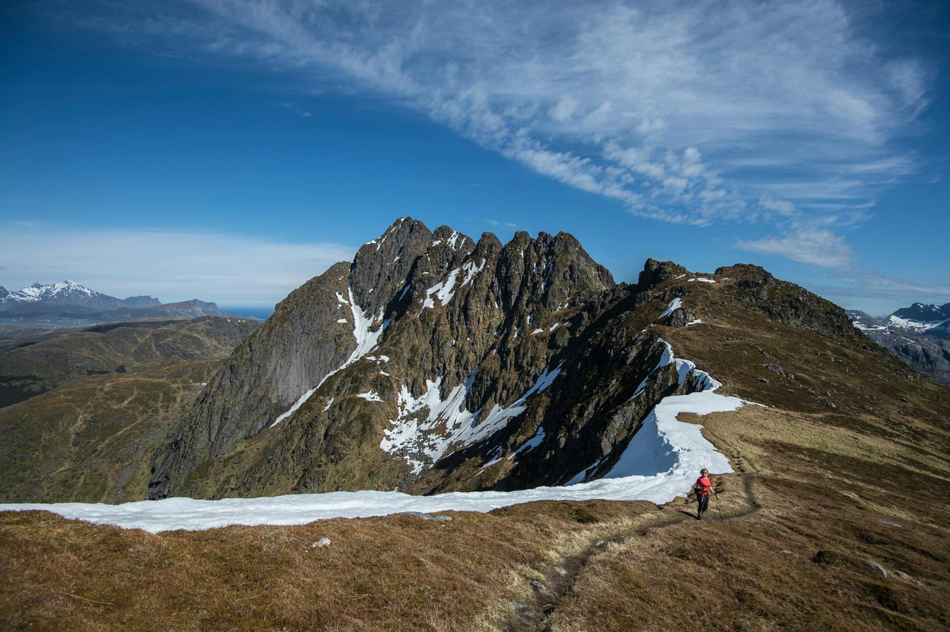 Woman Holding A Trekking Pole At mountain Peak