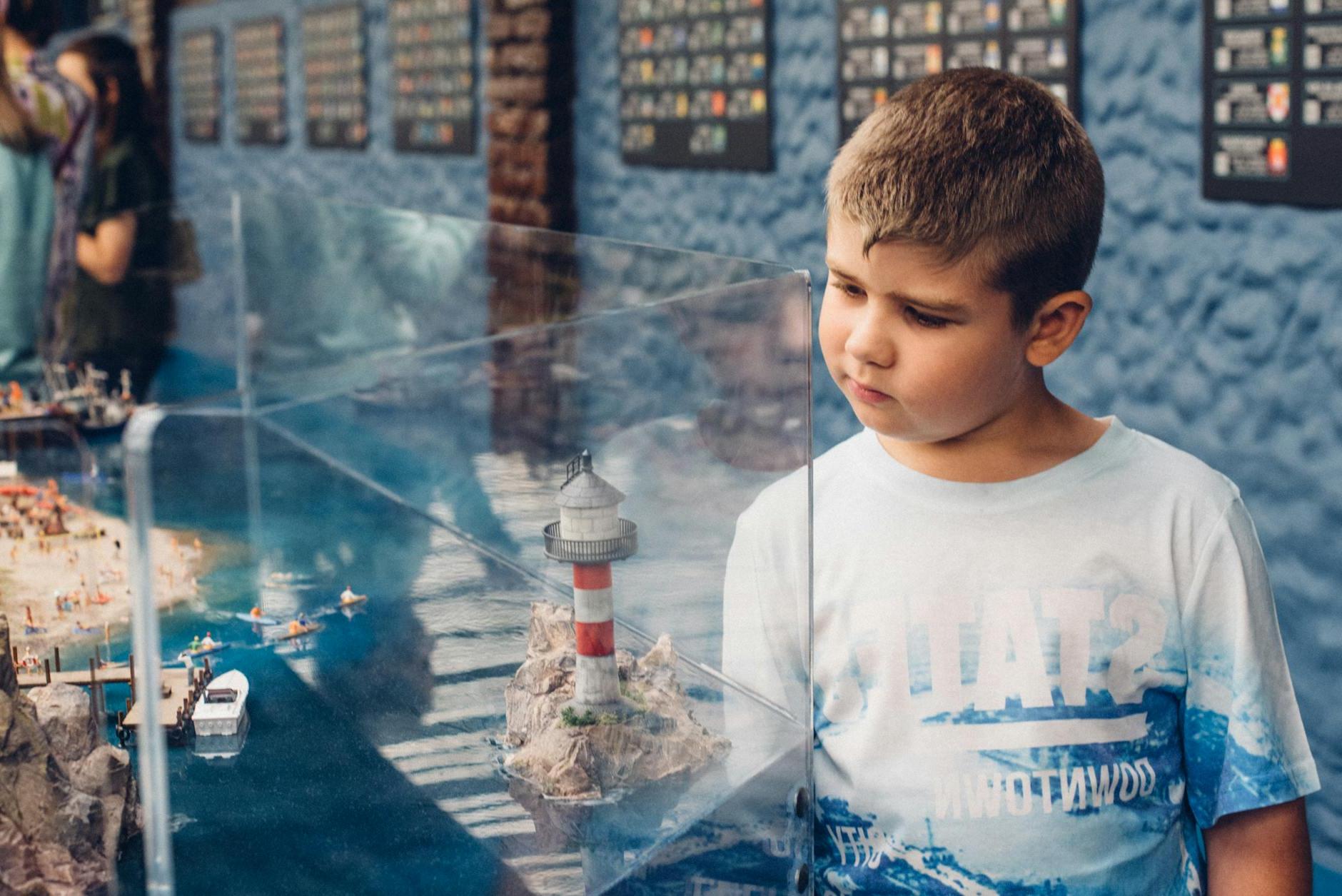 A Boy Looking at the Lighthouse