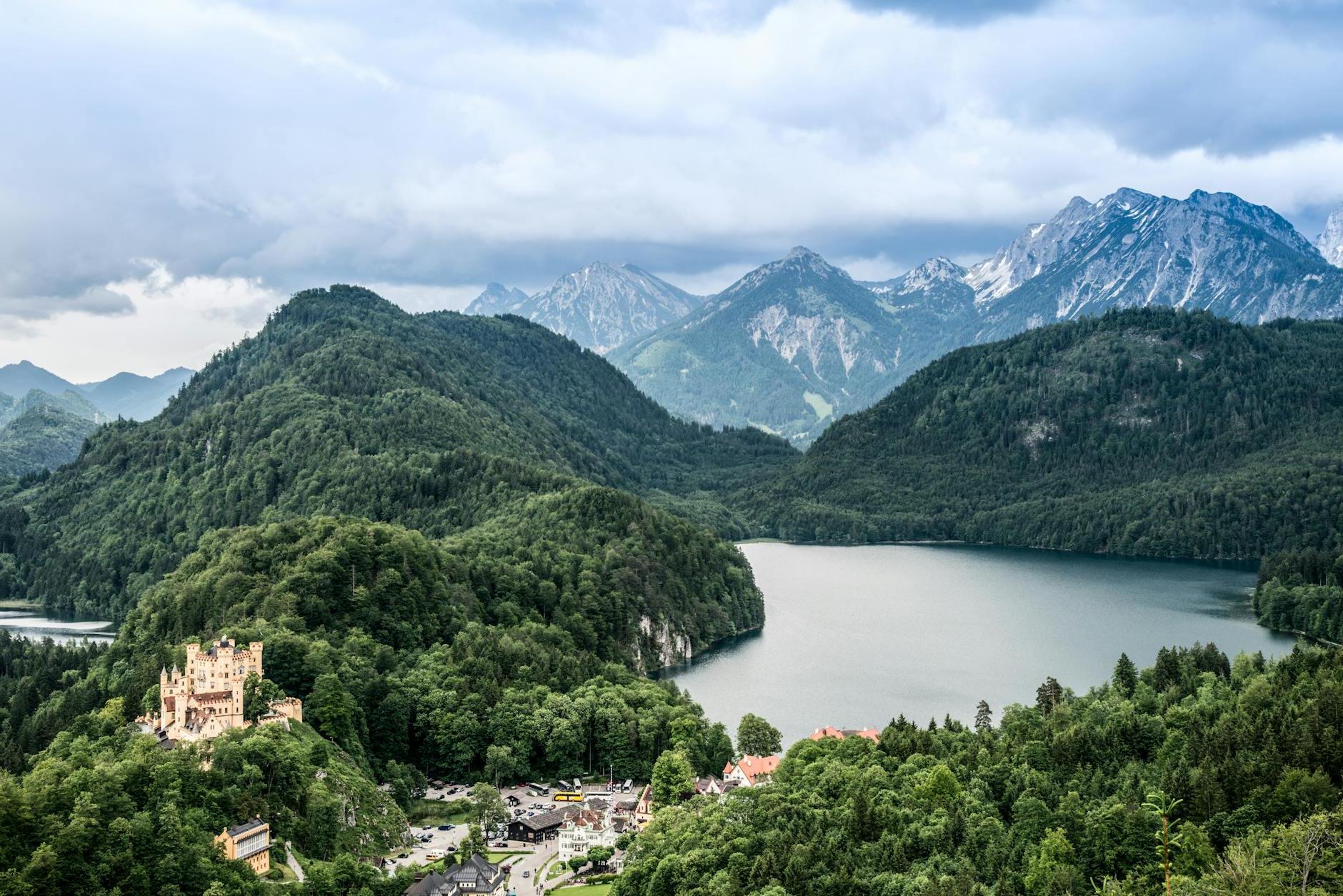 Green Mountains Near River Under Blue Sky