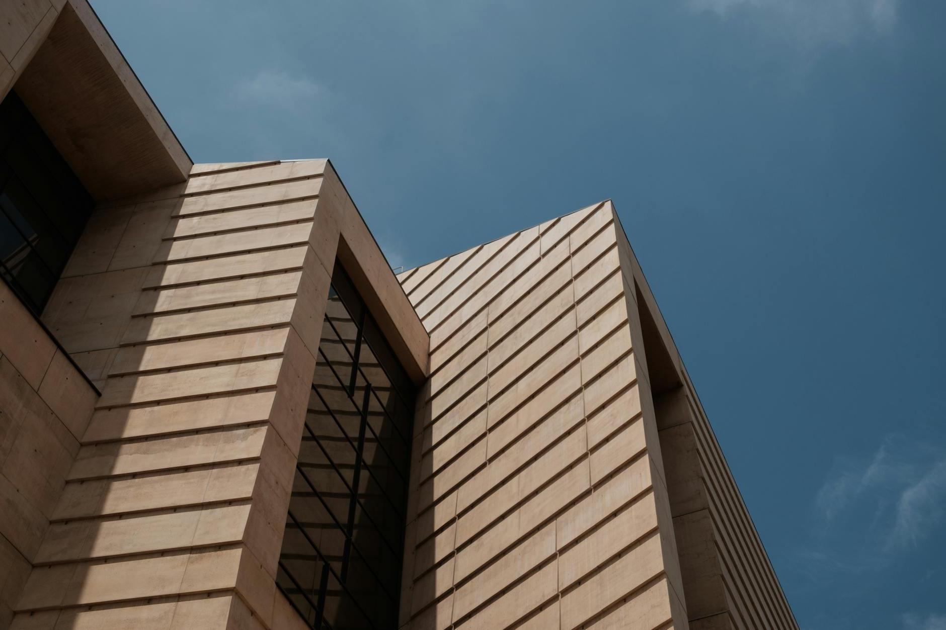 Brown Concrete Building Under Blue Sky