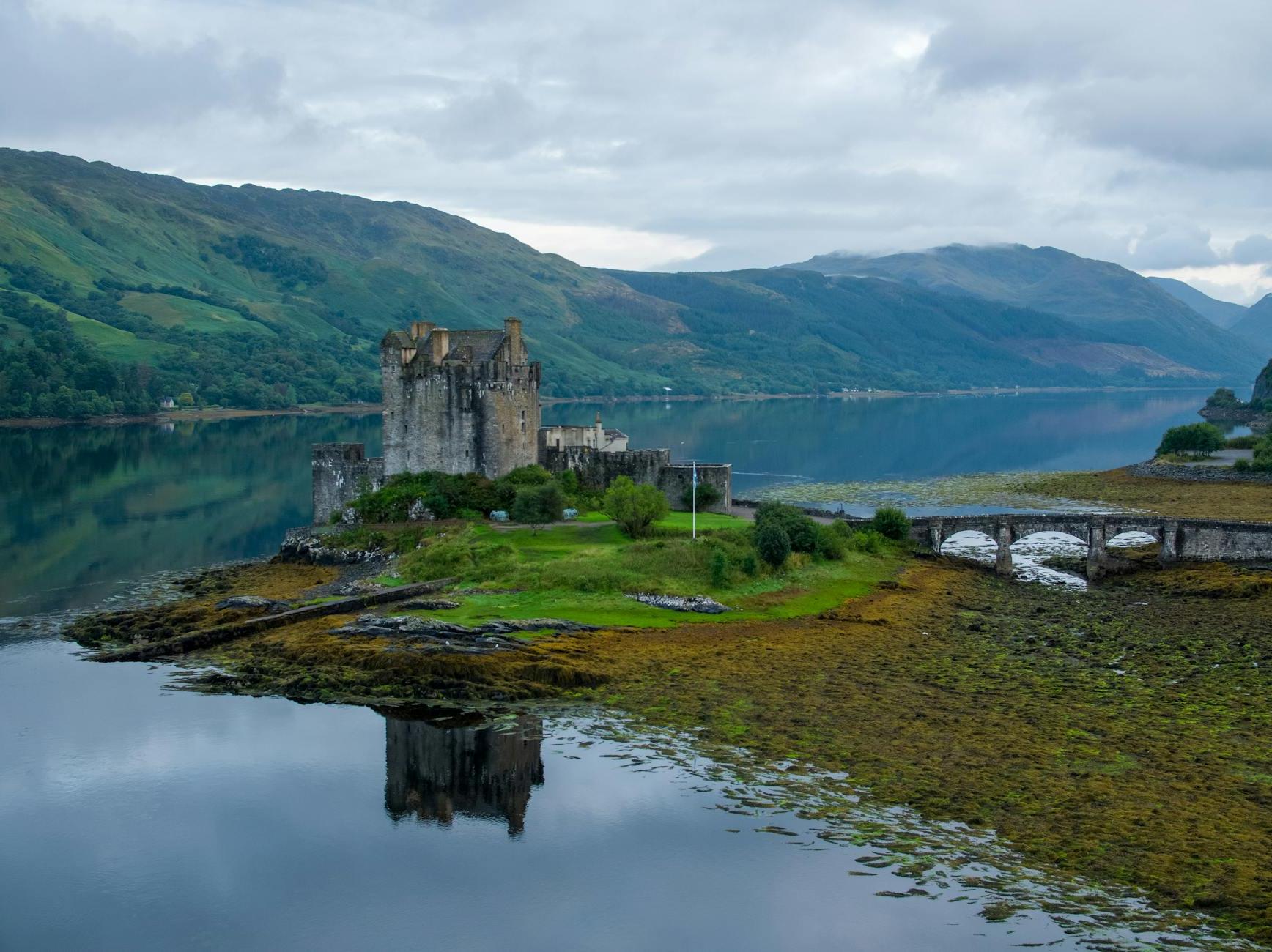 An Aerial Shot of a Castle beside a Lake