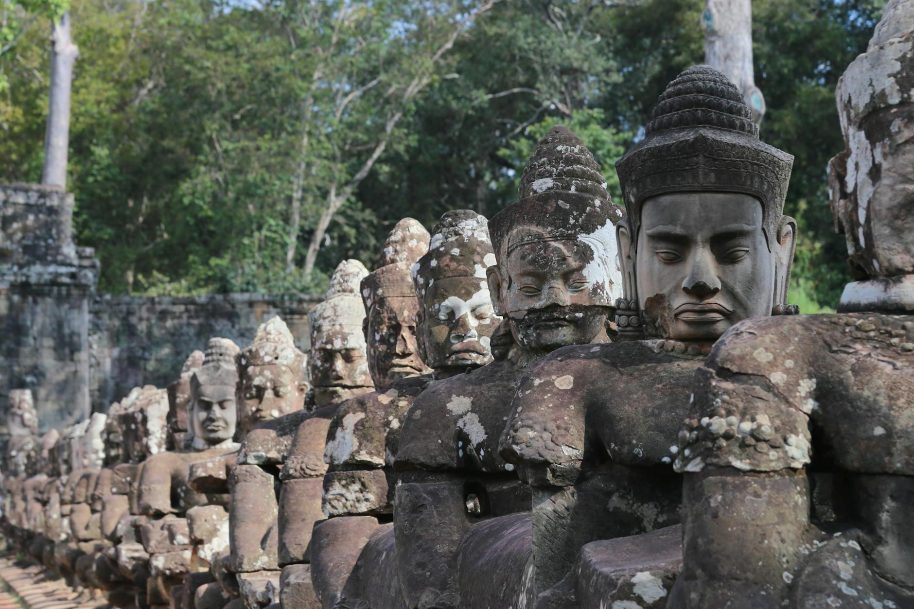 Aged stone statues of Buddha in Angkor Thom