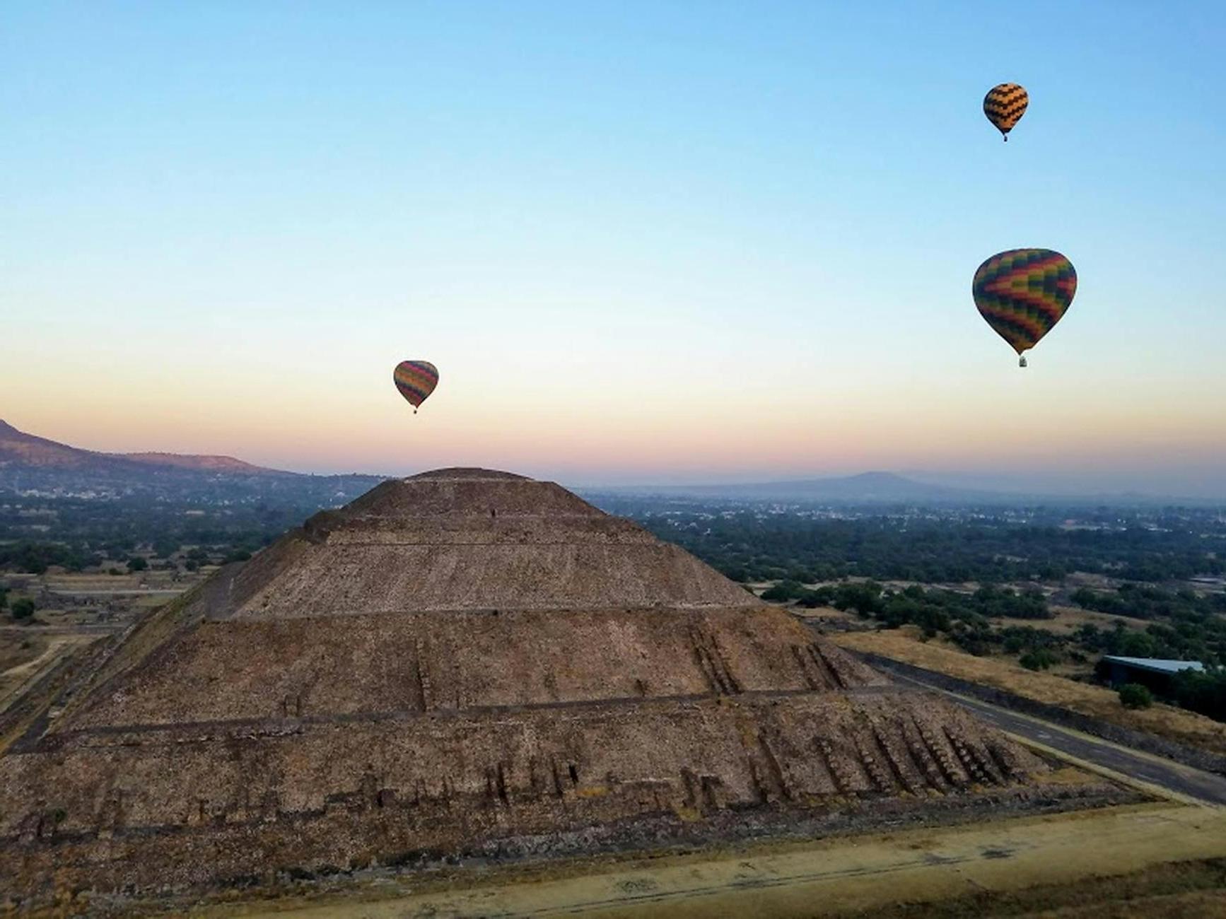 Ancient Pyramid of Sun under flying air balloons in Teotihuacan