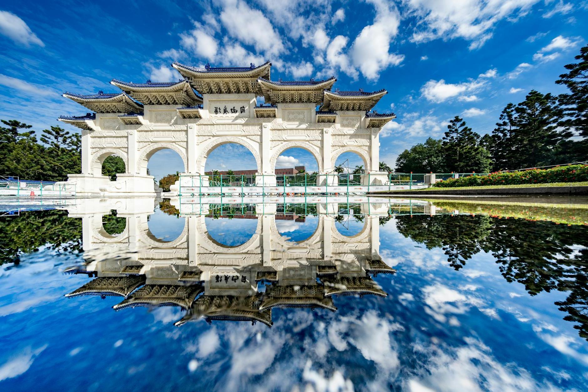 White oriental memorial archway in sunny day