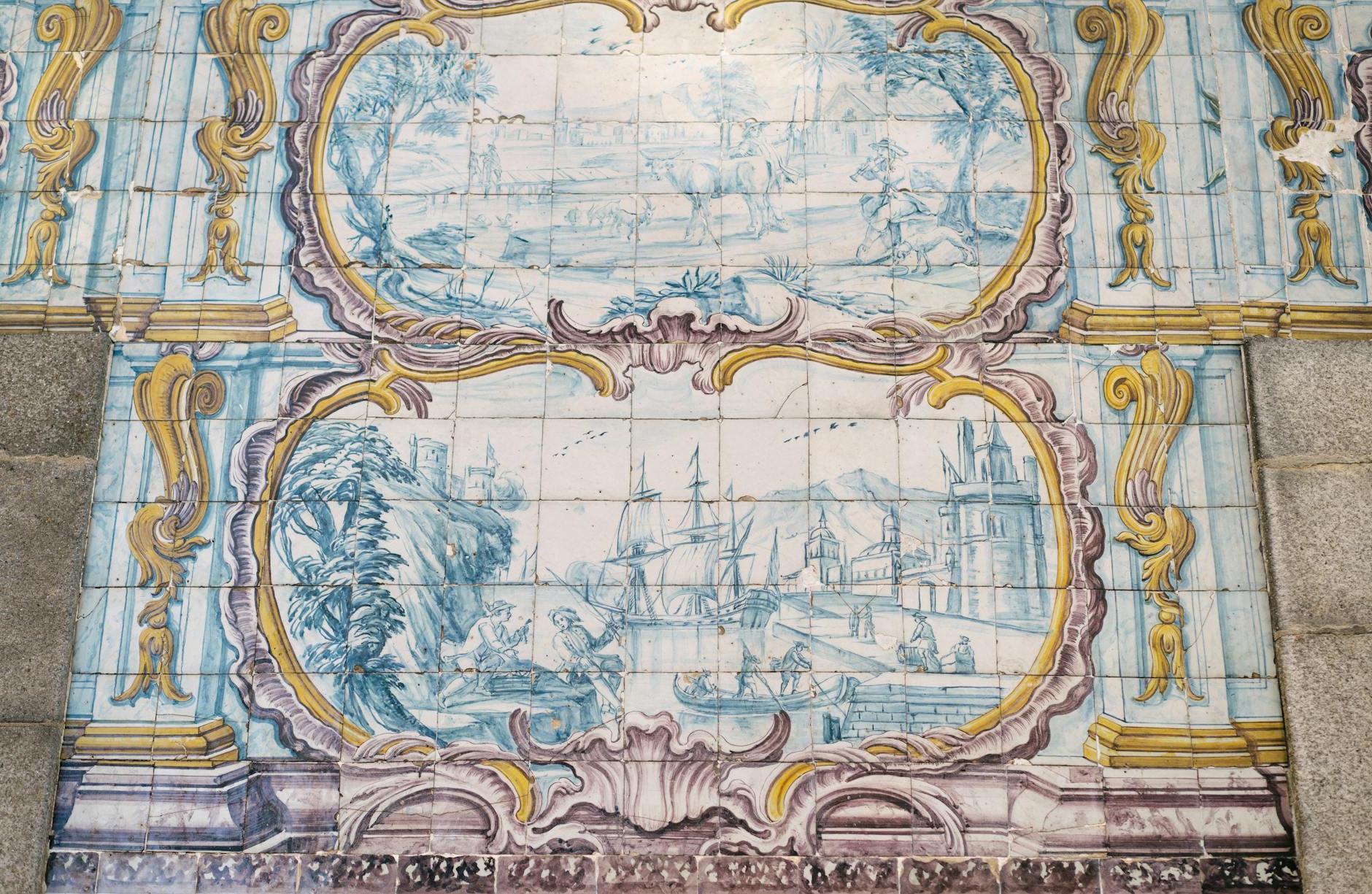 Amazing Azulejo tin glazed ceramic tilework depicting pastoral scene and ship in port on wall of building in Porto city in Portugal