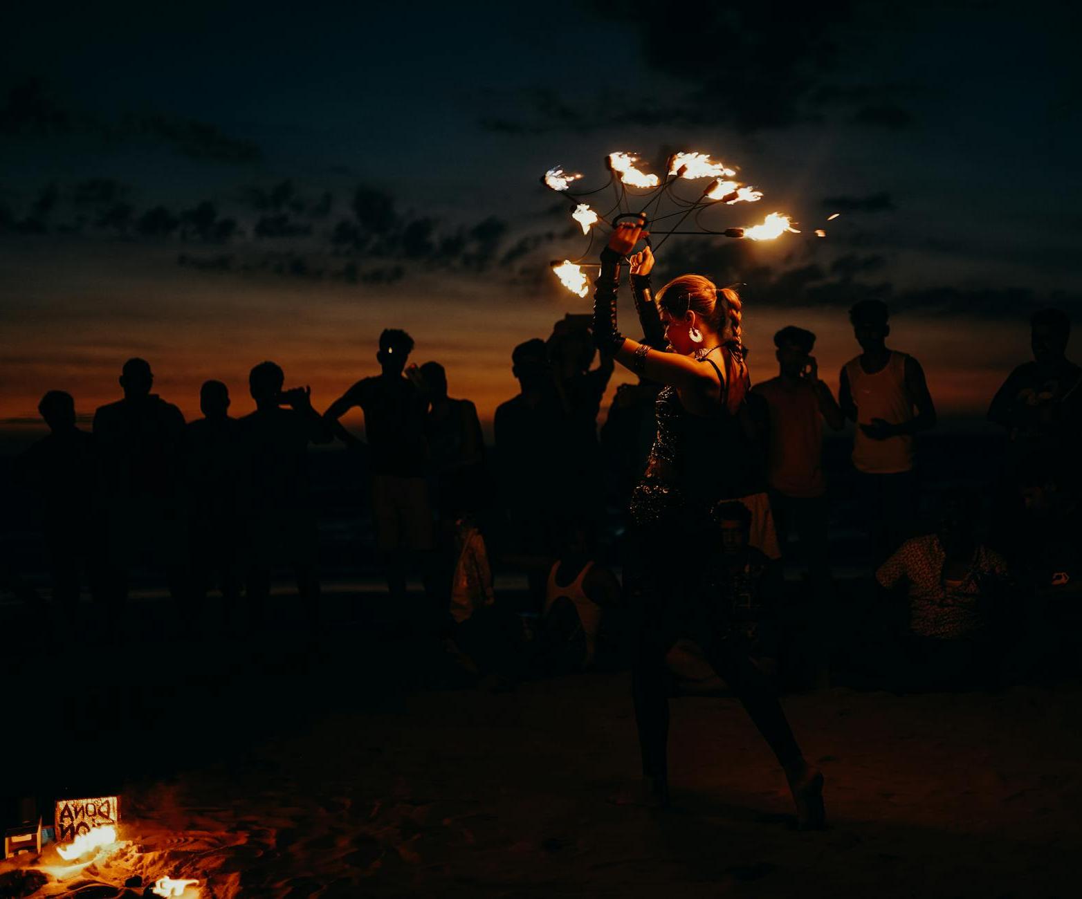 People Standing on Beach during Night Time