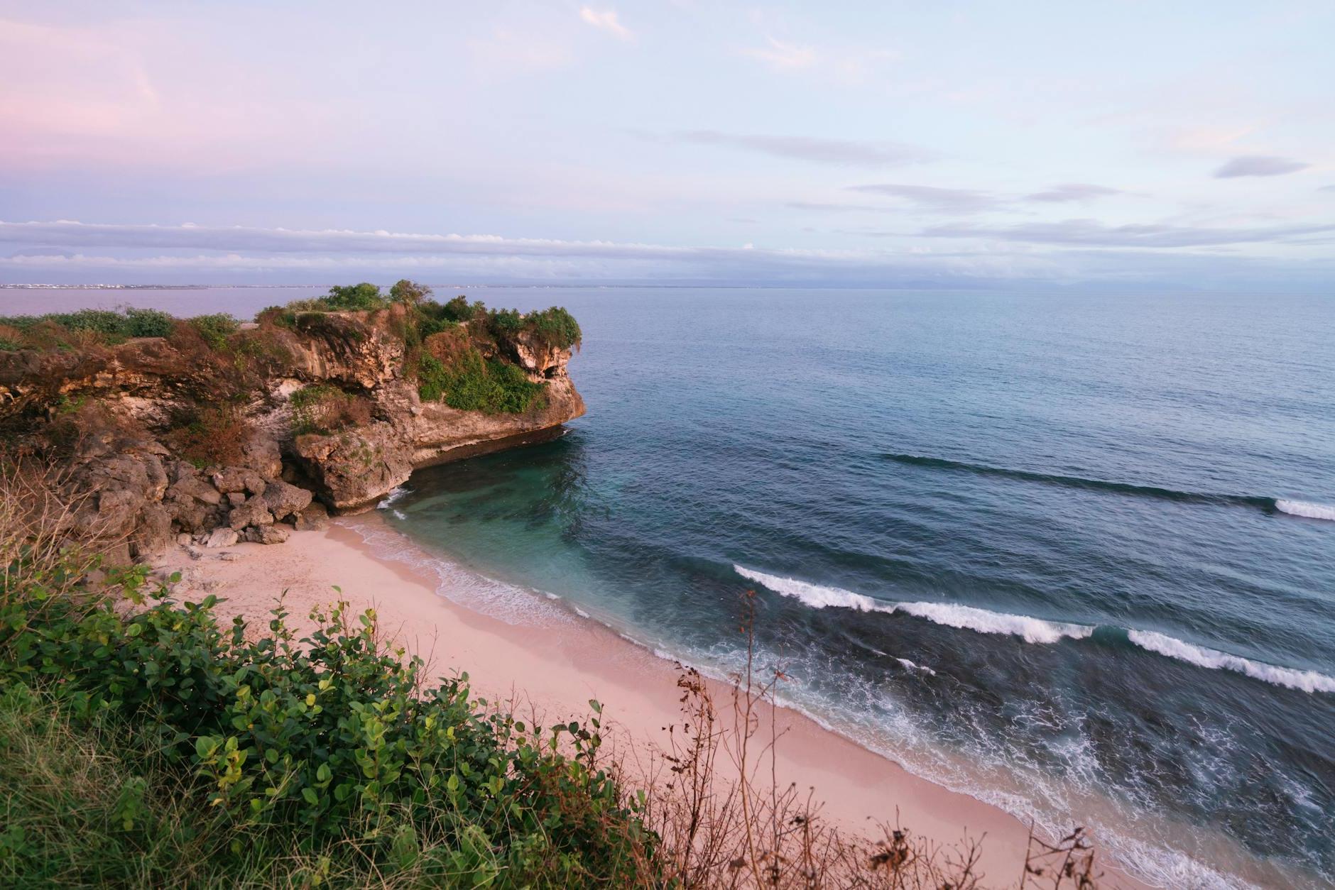 Amazing view of beach with rocky cliff