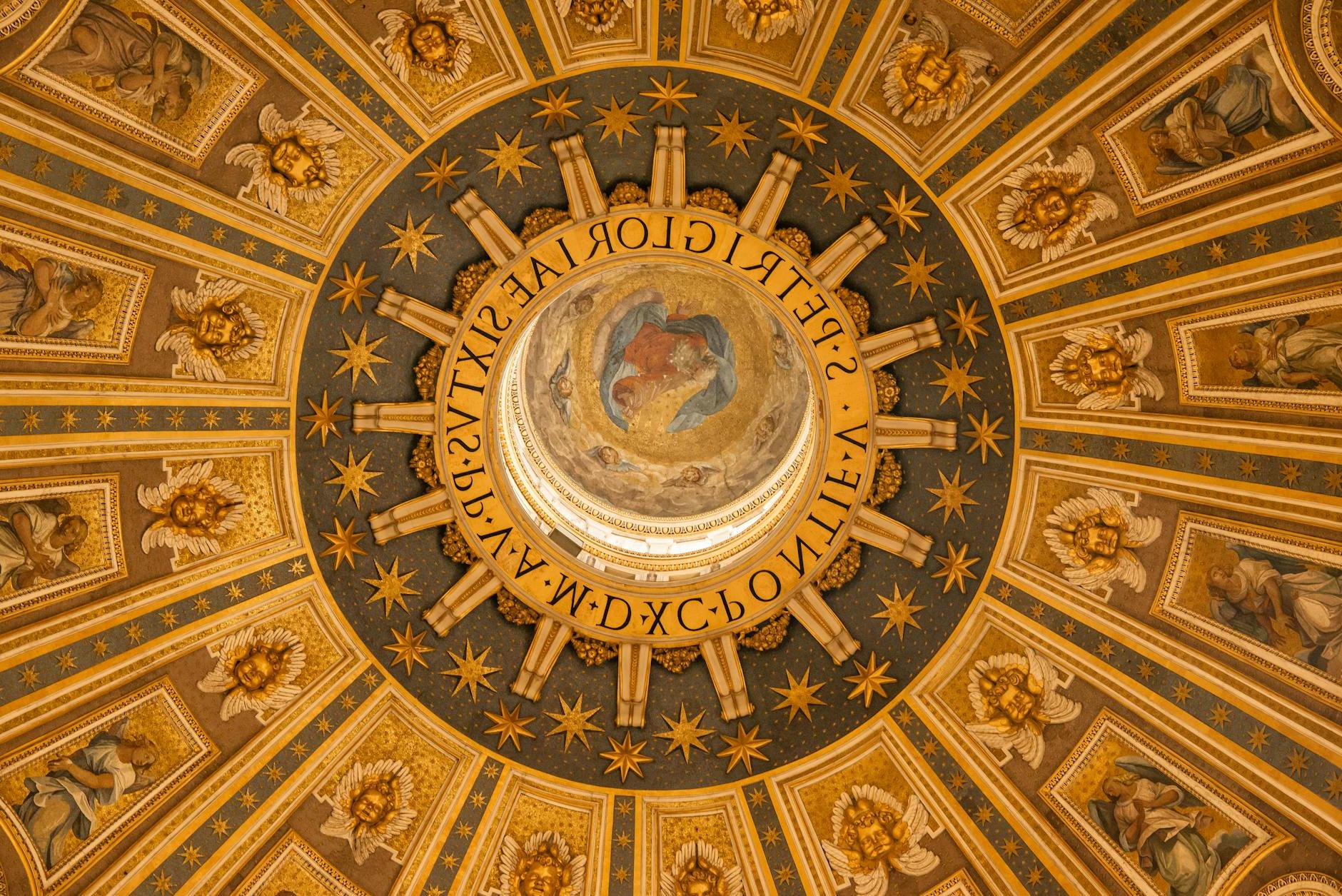 From below wonderful ornamental design of ancient dome inside St. Peters Basilica in Rome