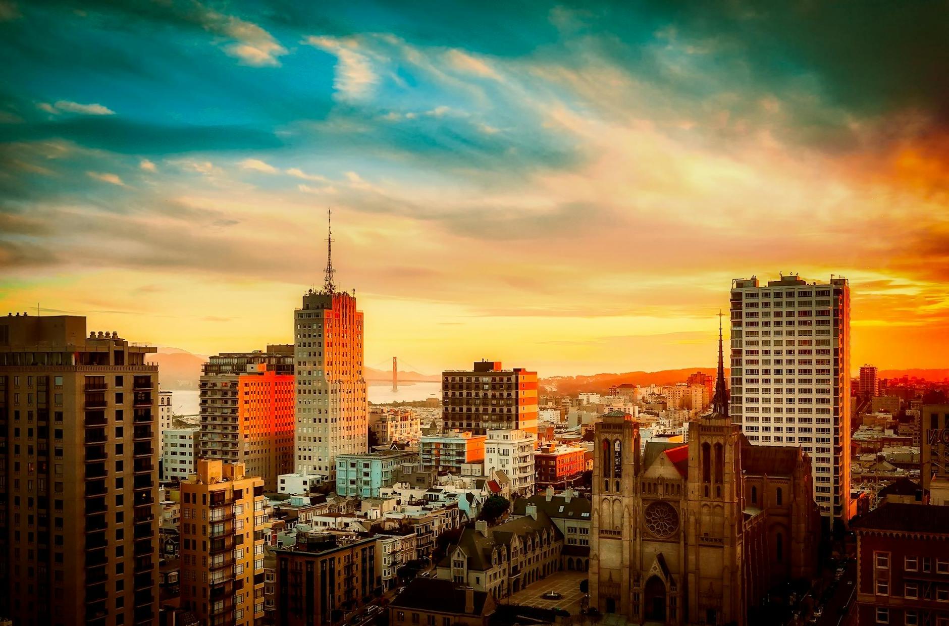 Buildings Under Cloudy Sky during Sunset