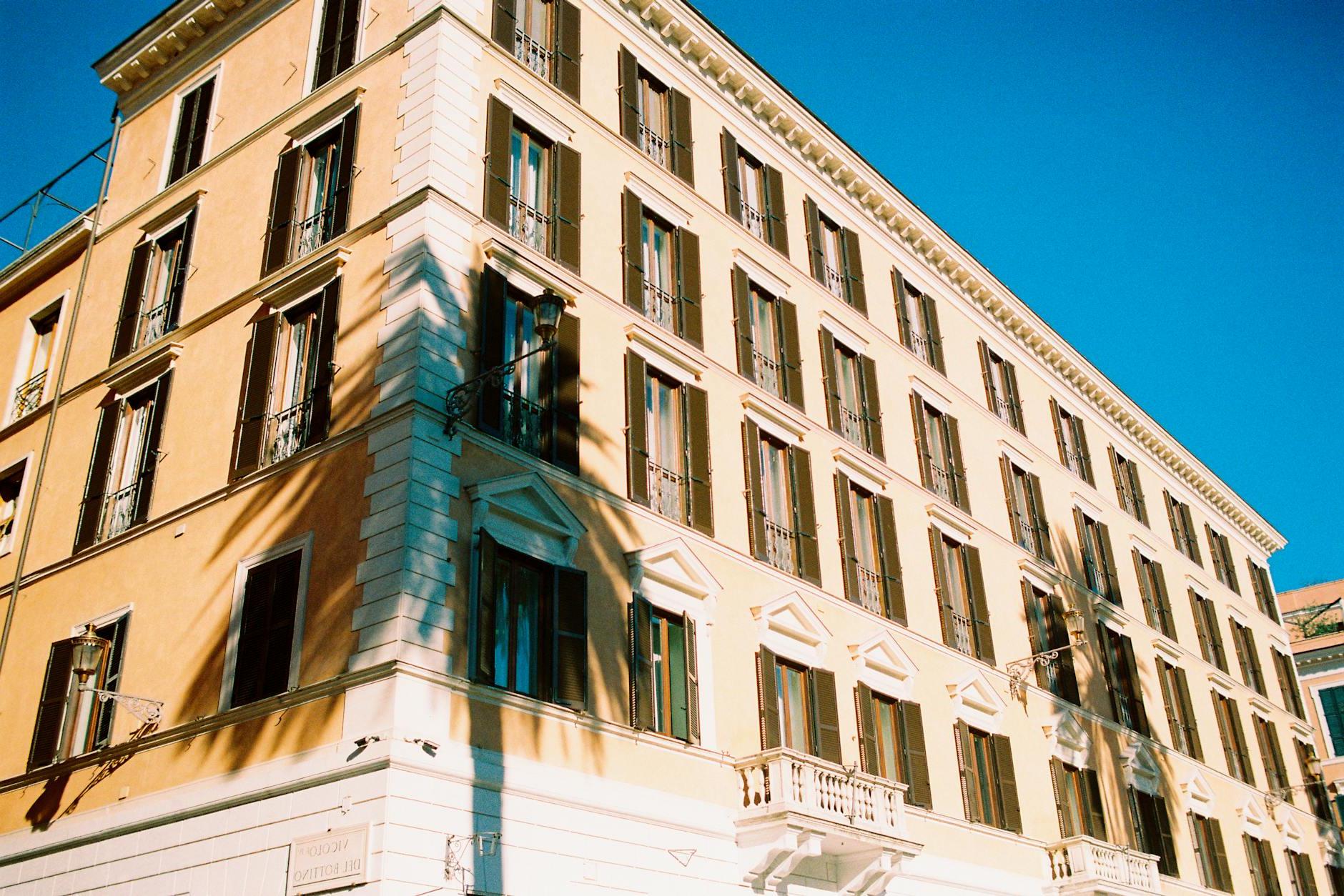 Shadows of Palm Trees on the Facade of a Building in Piazza di Spagna in Rome