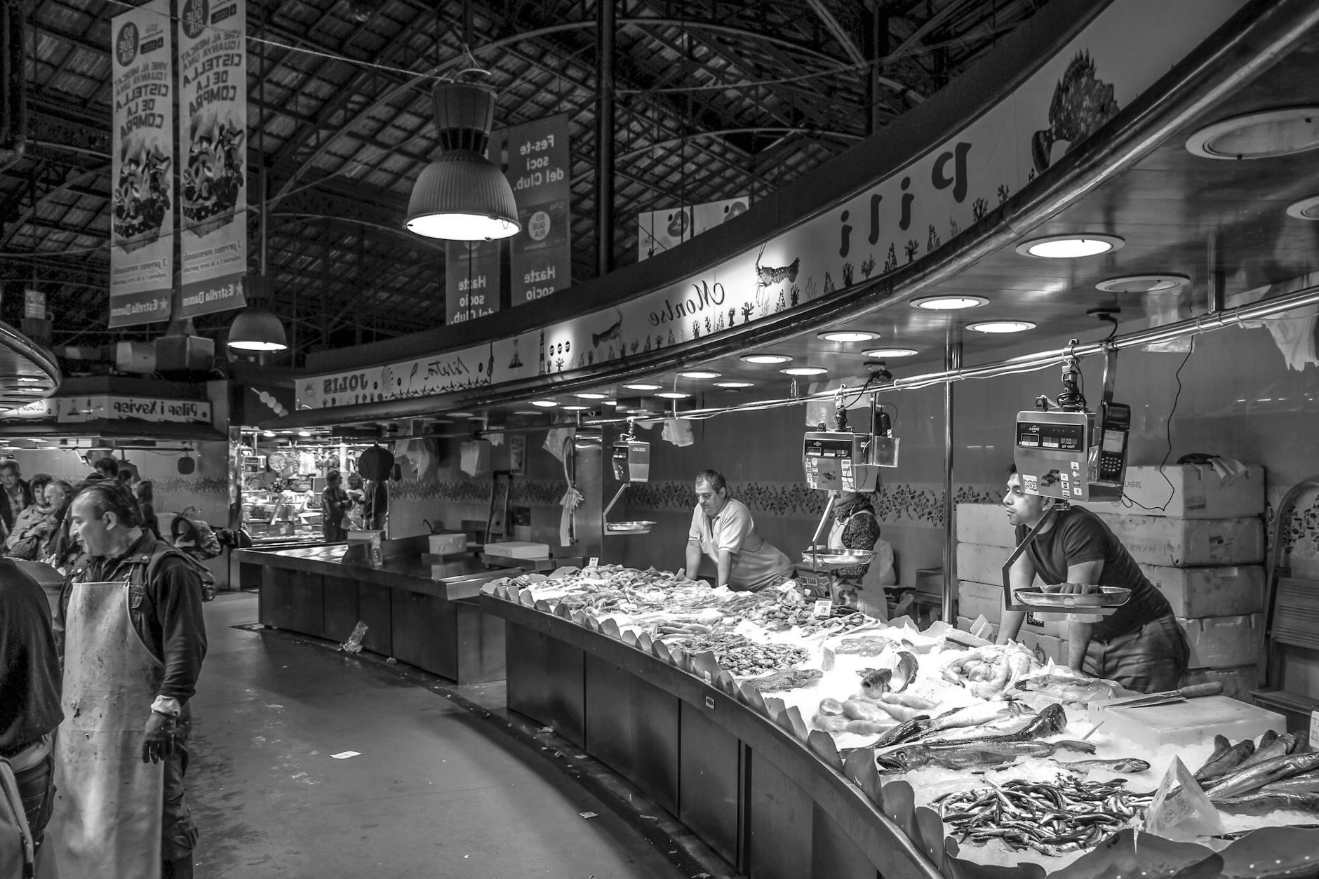 Gray Scale Photo of a People in Market