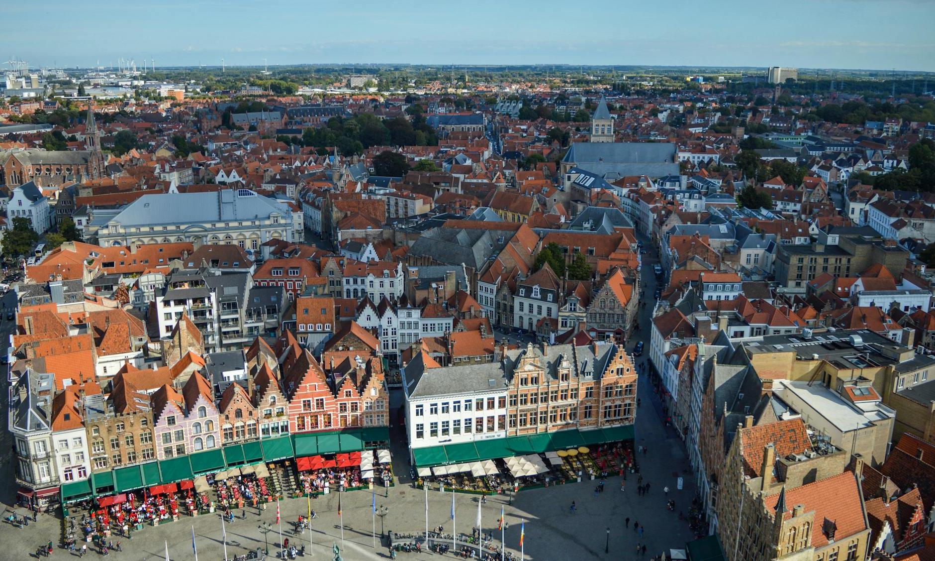 Amazing aerial view of Markt square and aged typical buildings in historical center of Bruges on sunny day