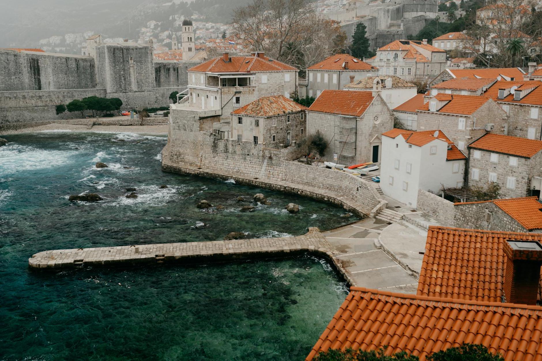 Old town with small houses and gray castle