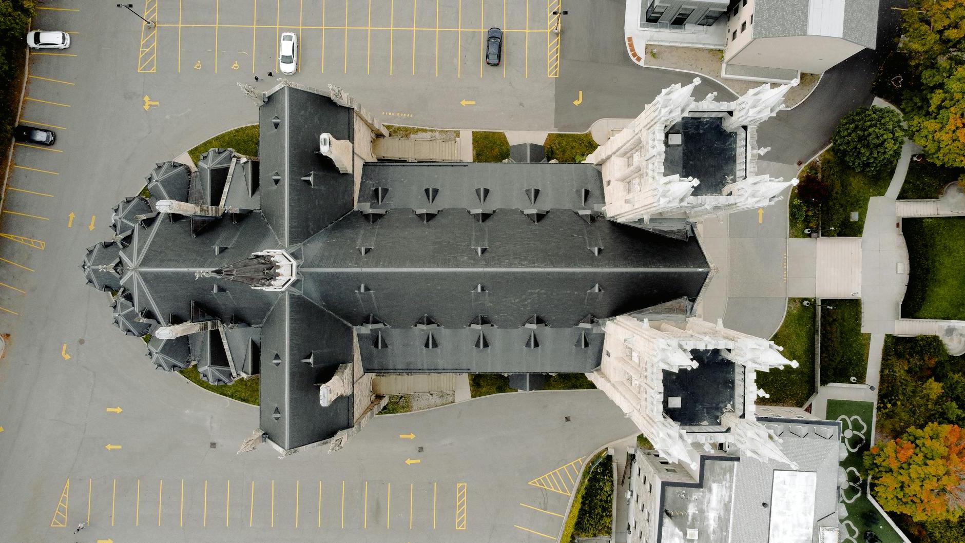 Drone view of roof of high building of educational institution complex located in downtown of USA