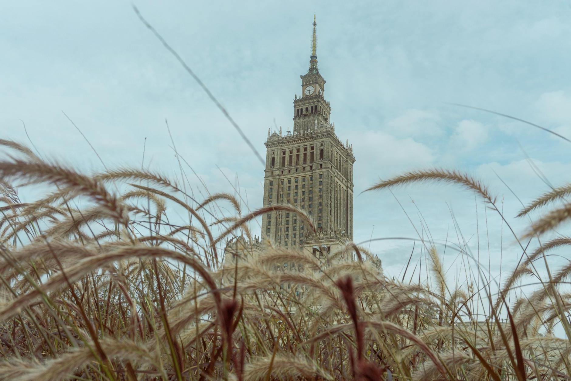 View of the Palace of Culture and Science in Warsaw, Poland Under White Clouds