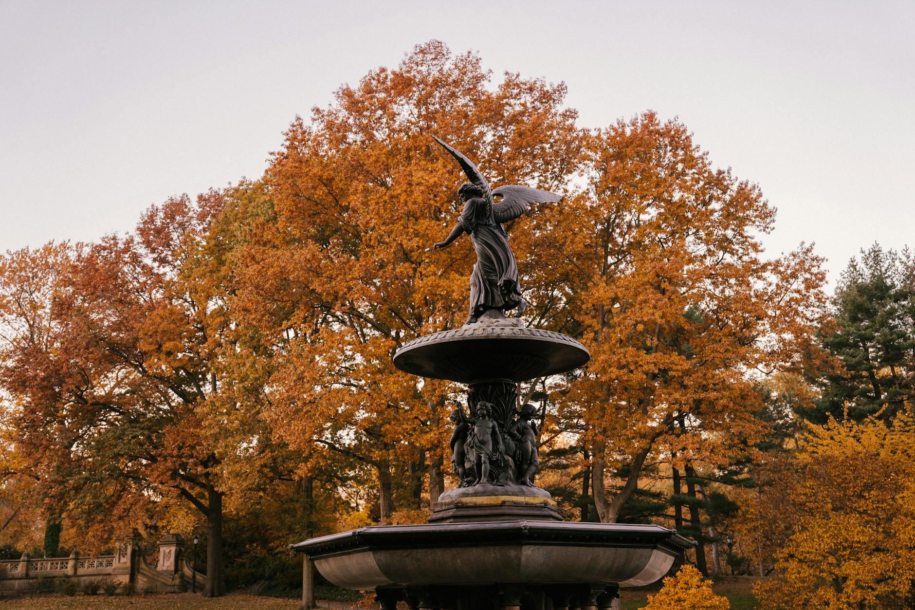 Fragment of Bethesda Fountain with Angel of the Waters statue placed in Central Park in New York City in America in autumn time