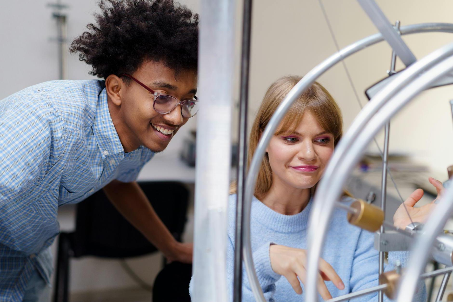 Man and a Woman Looking at an Experiment Together