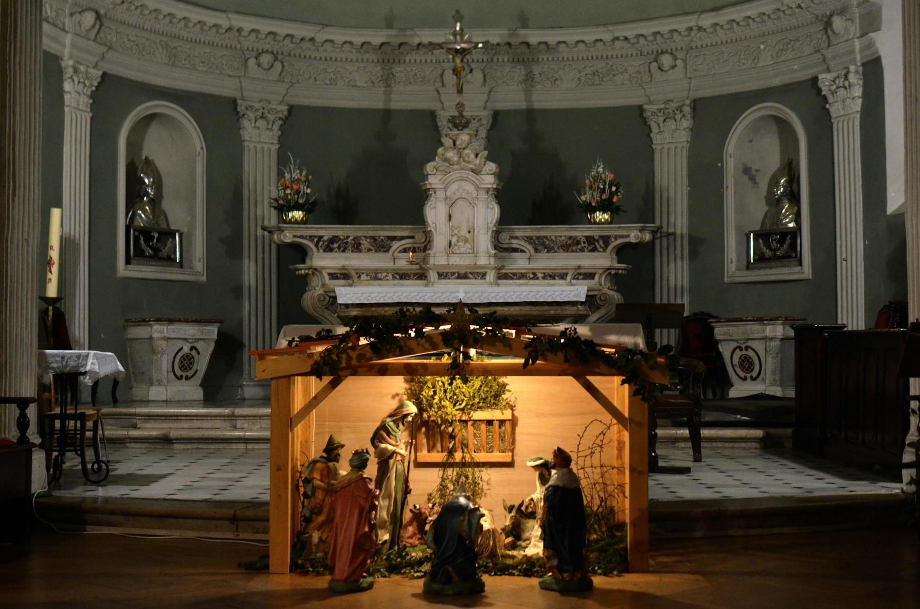 Interior of aged church with columns bas reliefs and sculptures depicting biblical scenes