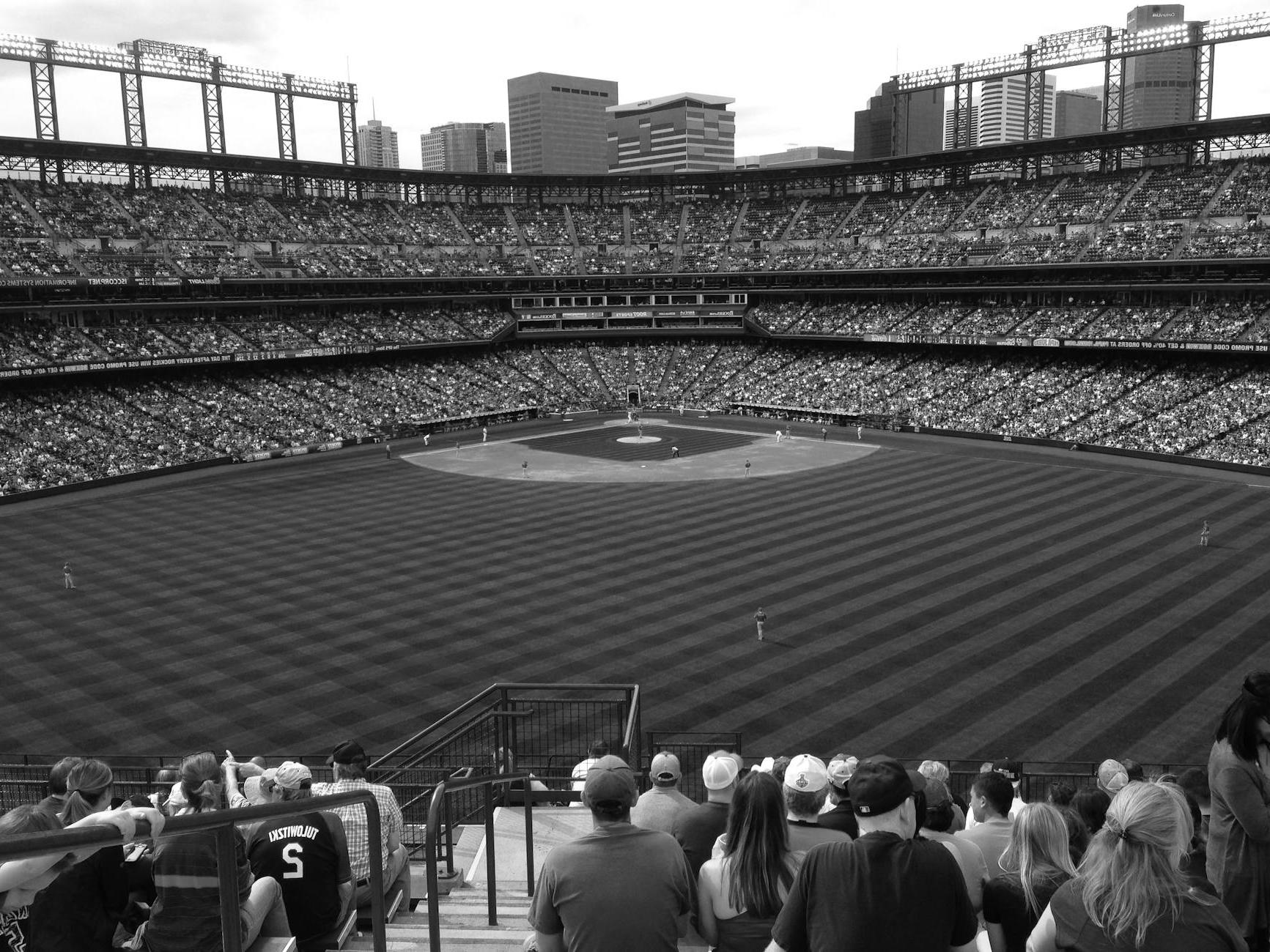 Grayscale Photo of People Watching a Baseball Game