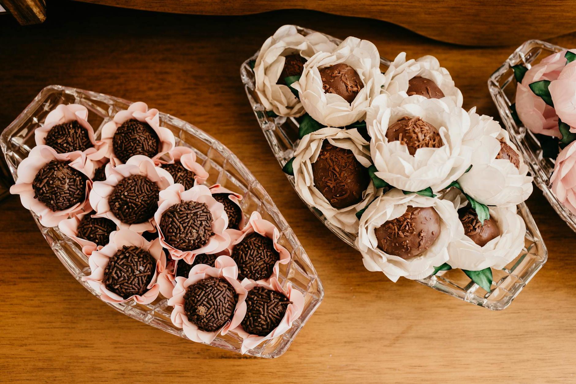 Assorted delicious chocolate truffles in decorative flowers