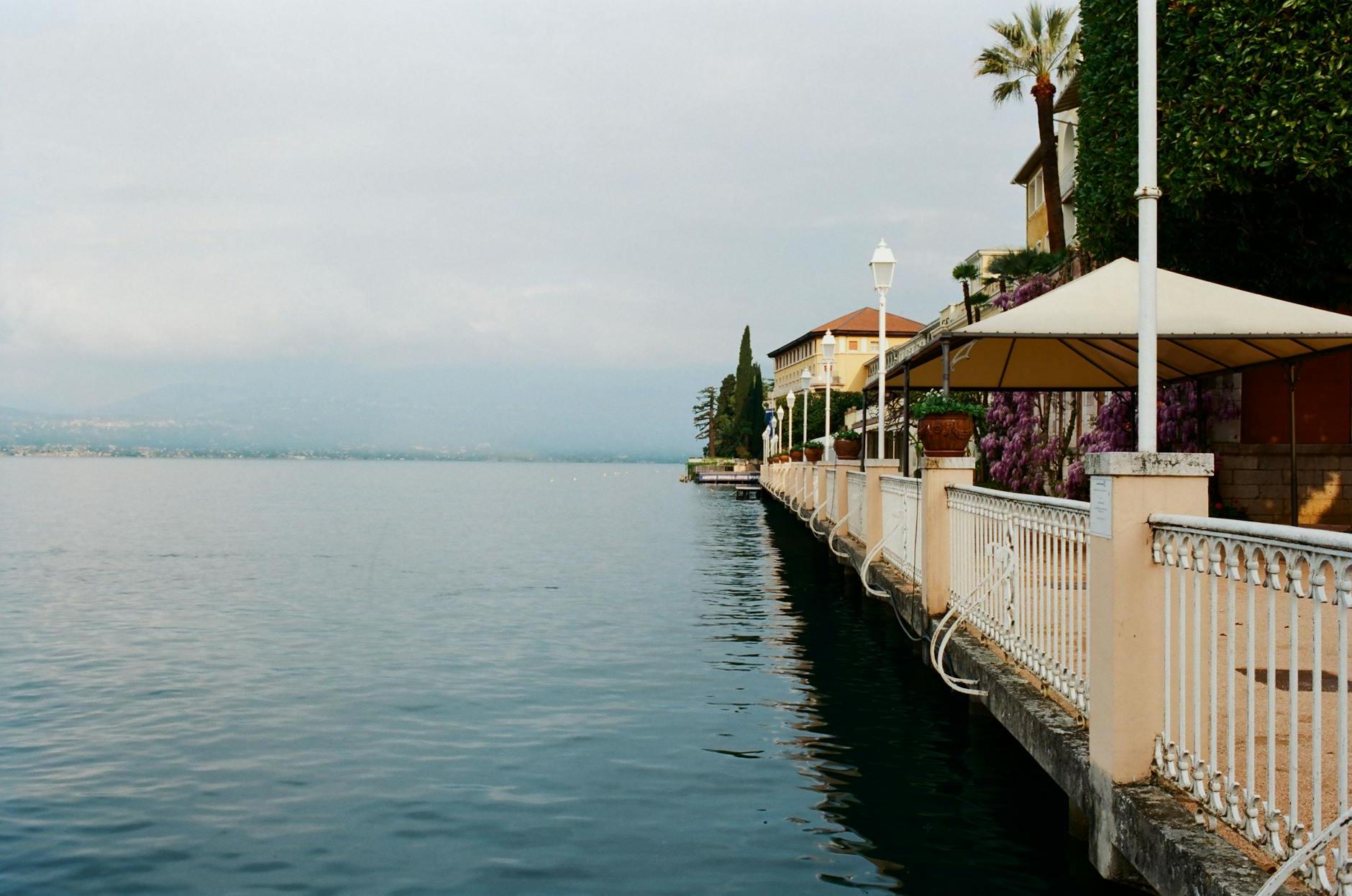 Promenade near calm blue sea in resort