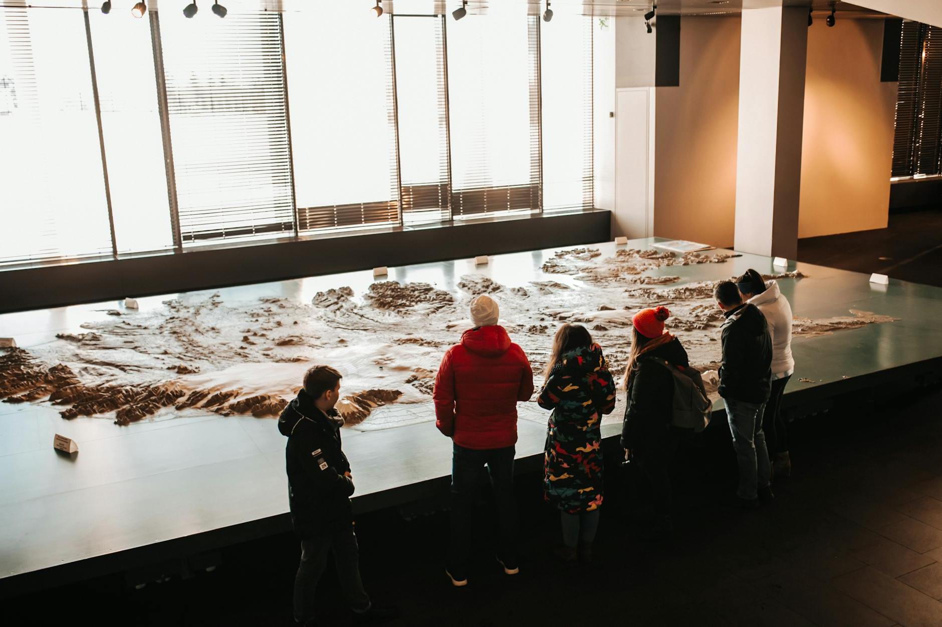 Teenagers in Museum near Iceland Map