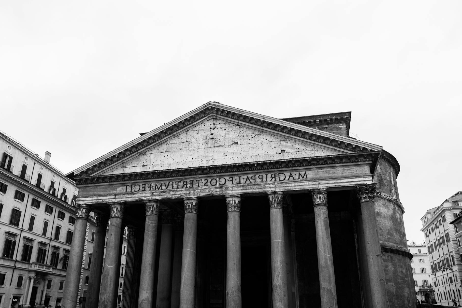 Ancient Roman temple facade between buildings in city