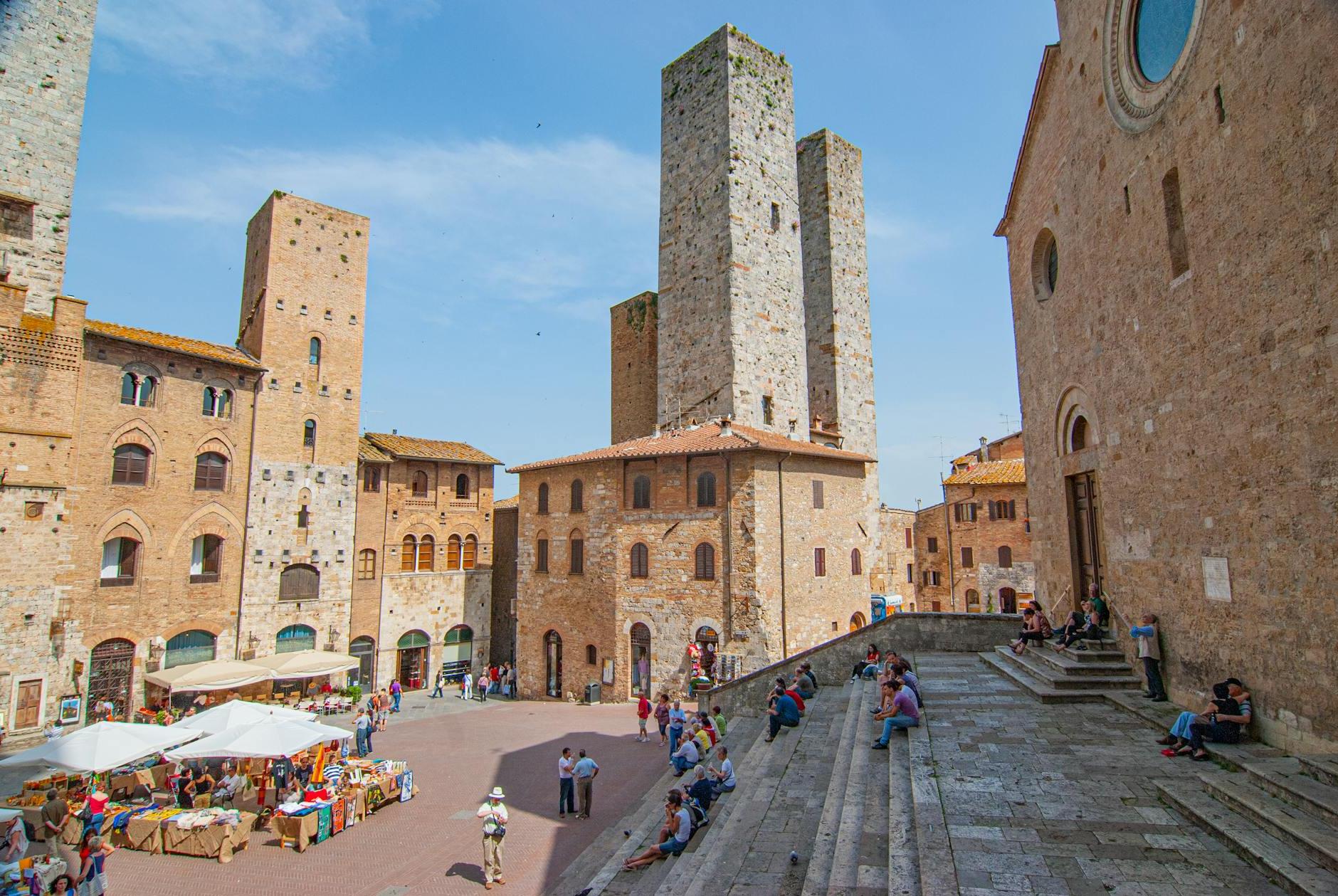 People at Piazza del Duomo in San Gimignano, Italy