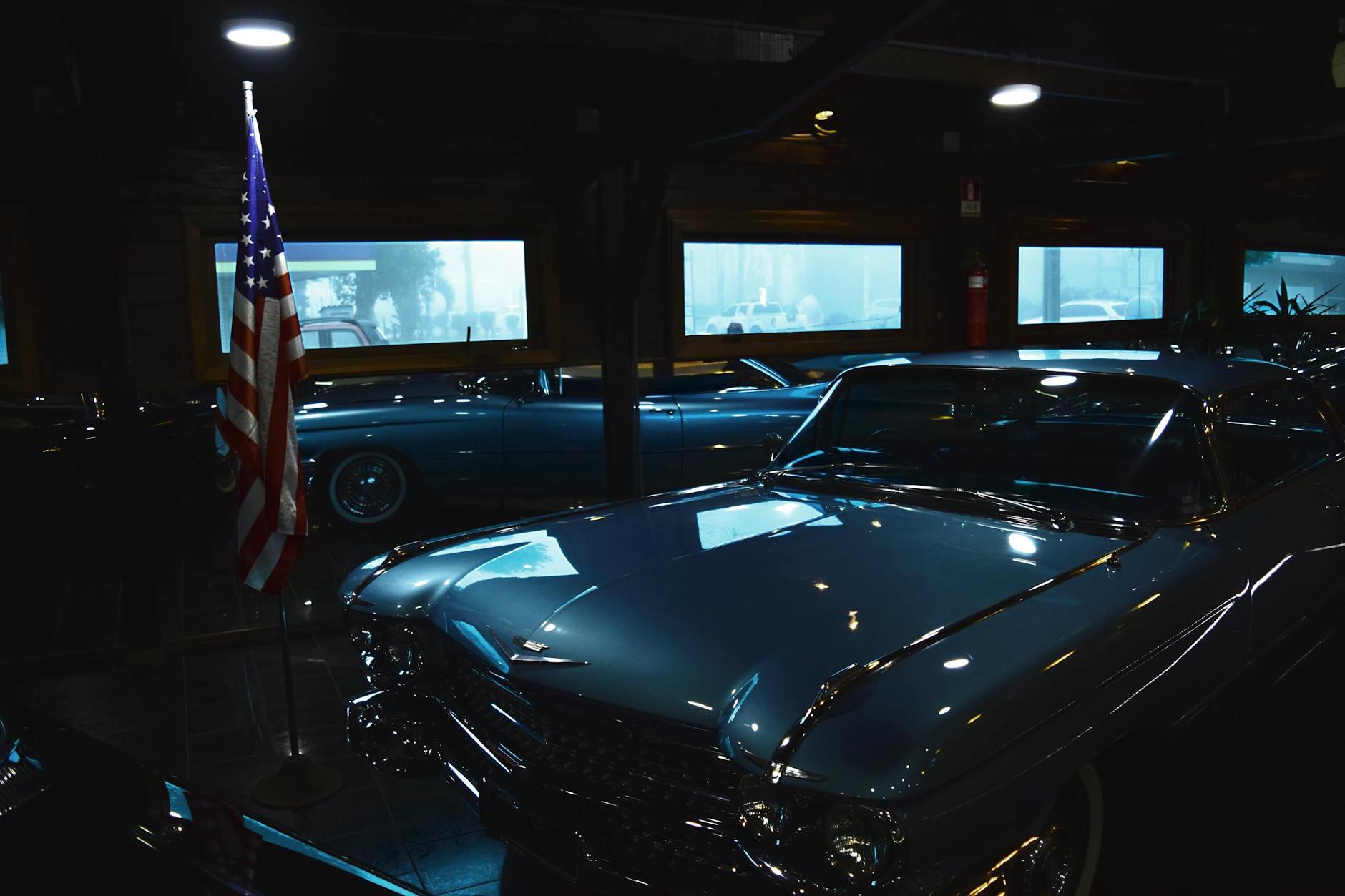 Classic Gray Chevrolet Car Near Us Flag Inside Garage