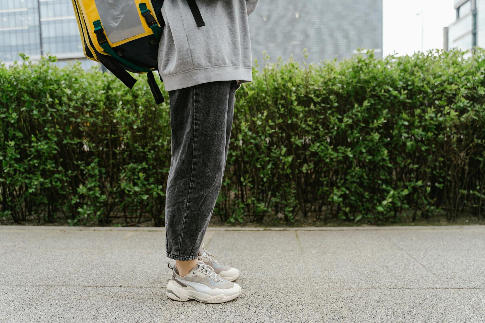 Person Standing on the Sidewalk