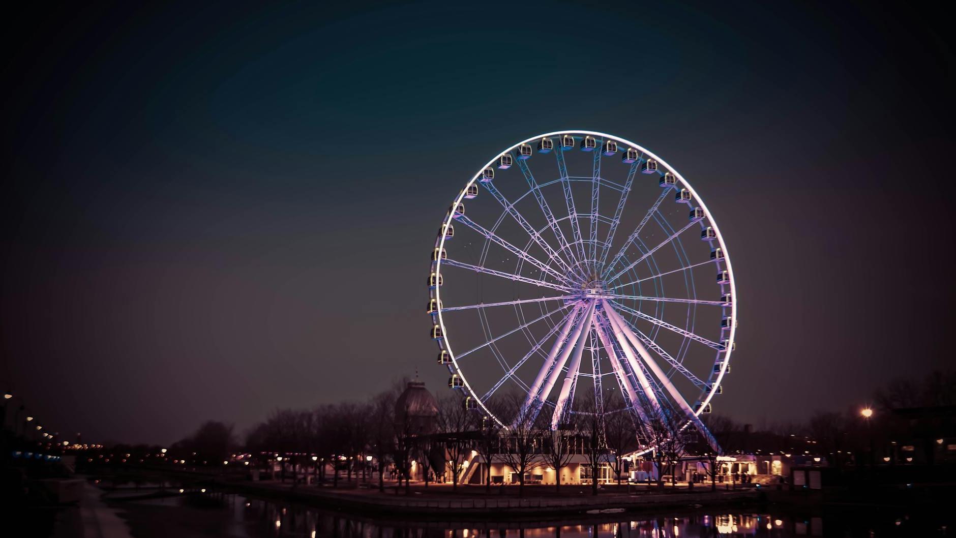 Photograph of a Ferris Wheel with Purple Lights