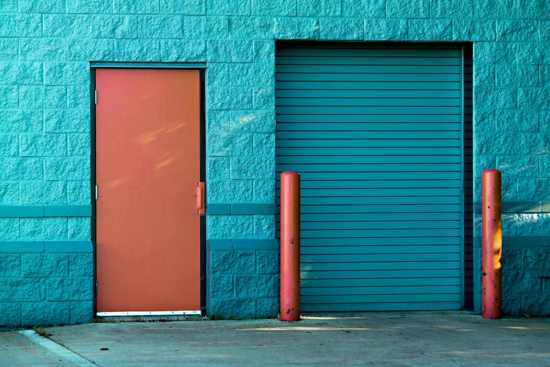 Brown Panel Door Near Roll-up Gate