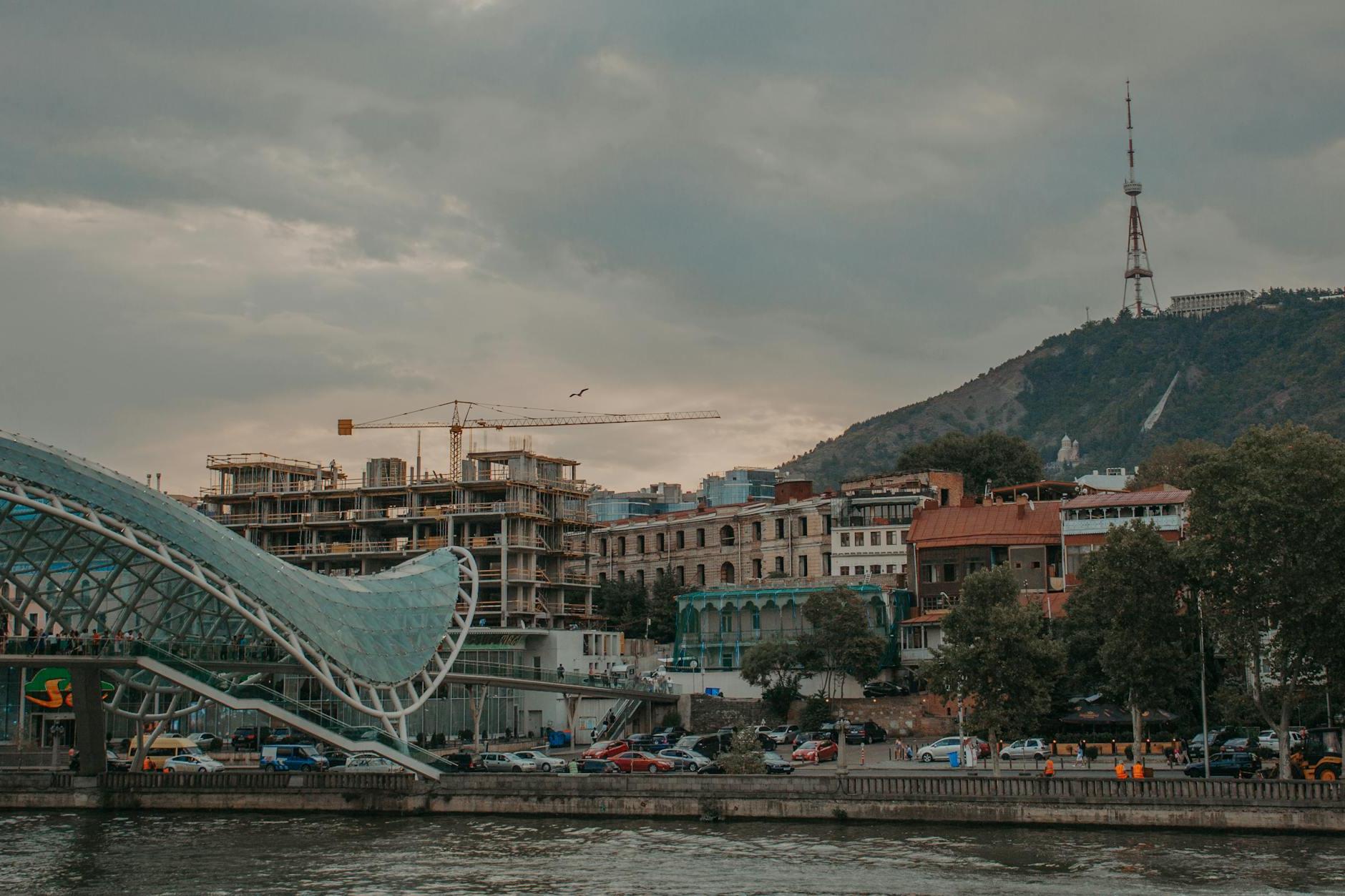 Waterfront view of Tbilisi with Bridge of Peace Visible in Georgia