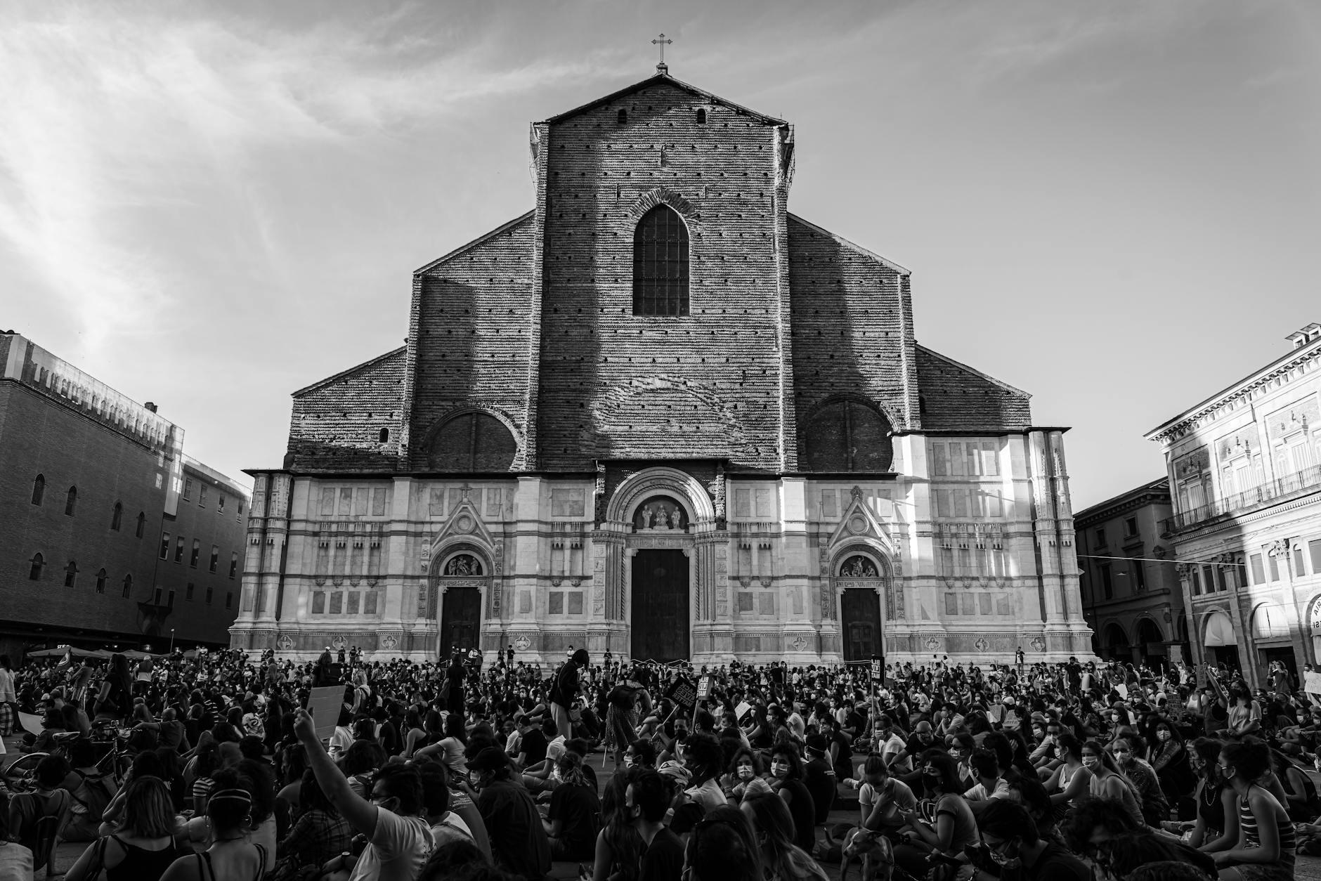 Grayscale Photo of People in Front of Church